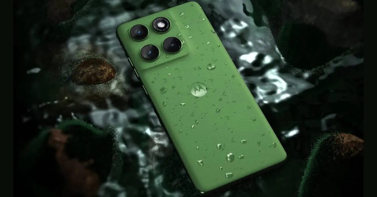 Motorola Edge 60 smartphone in Pantone Shamrock color with triple rear cameras and water droplets on the back panel