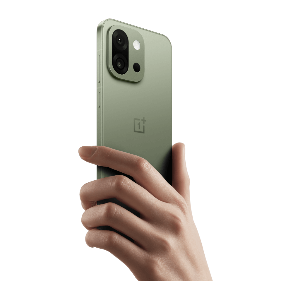 OnePlus 13s Silk Green being held in one hand showing its compact form factor