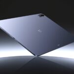 Digital render of the OnePlus Pad 3 floating mid-air, featuring a slim profile, brushed metal back, and a softly lit gradient background.