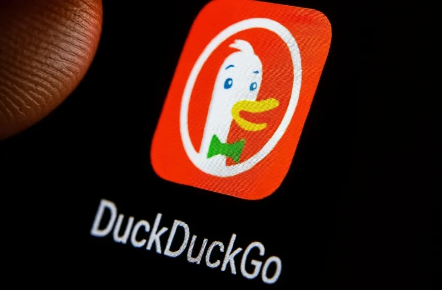 Close-up of DuckDuckGo app icon on smartphone screen under a fingertip