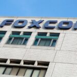 Foxconn headquarters building with logo visible under clear blue sky