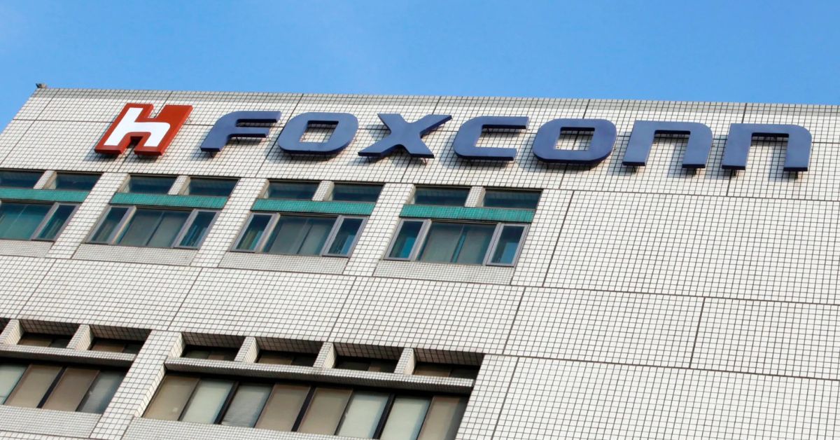 Foxconn headquarters building with logo visible under clear blue sky