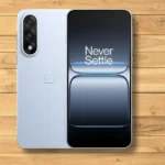 OnePlus Nord 5 phone placed on a light wooden tabletop with a clean, minimal background