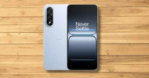 OnePlus Nord 5 phone placed on a light wooden tabletop with a clean, minimal background